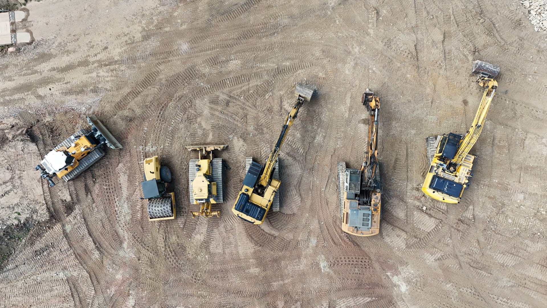 heavy construction machinery on a construction site from a drone